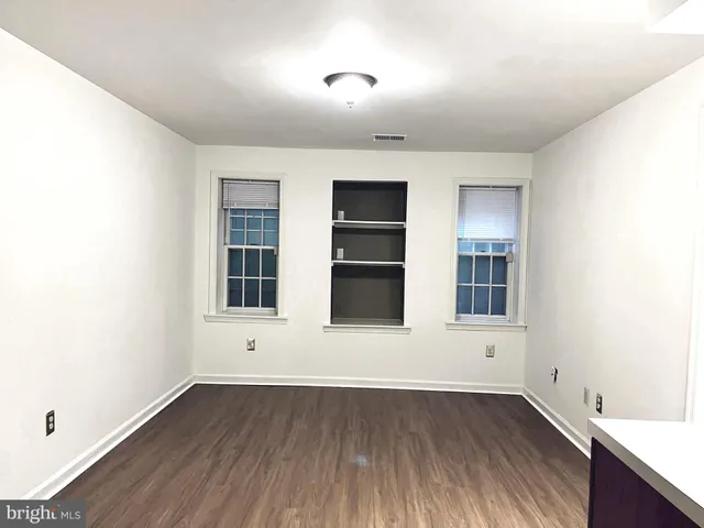 a bathroom with a sink vanity and a mirror