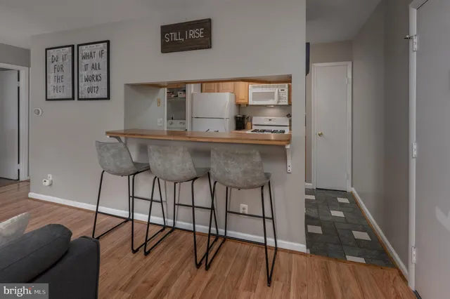 a kitchen with stainless steel appliances granite countertop a stove and a refrigerator