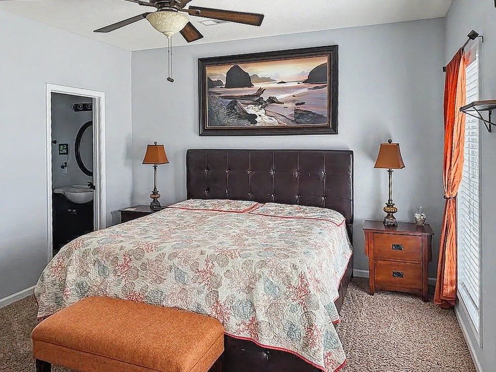 175 Ellen Lane Decaturville, TN 38329 - Photo 19 of 25 a bedroom with a bed and a chandelier