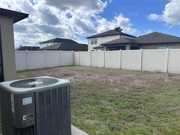 a view of a backyard with jacuzzi