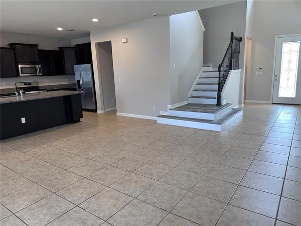 a view of kitchen with stainless steel appliances cabinets and counter space