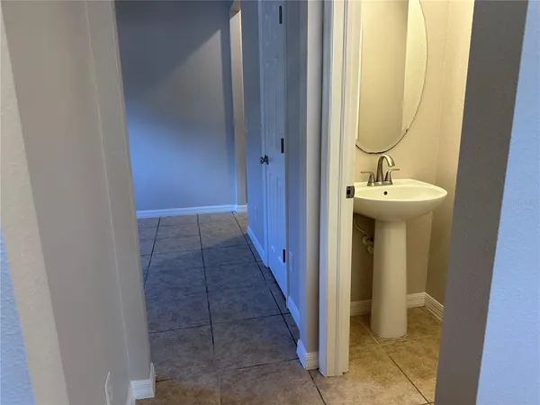 a bathroom with a sink and mirror