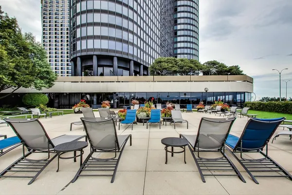 a view of a chairs and tables in the patio