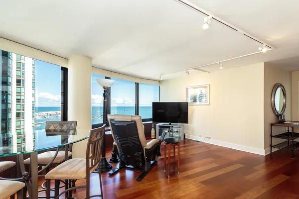 a view of a livingroom with furniture and a flat screen tv