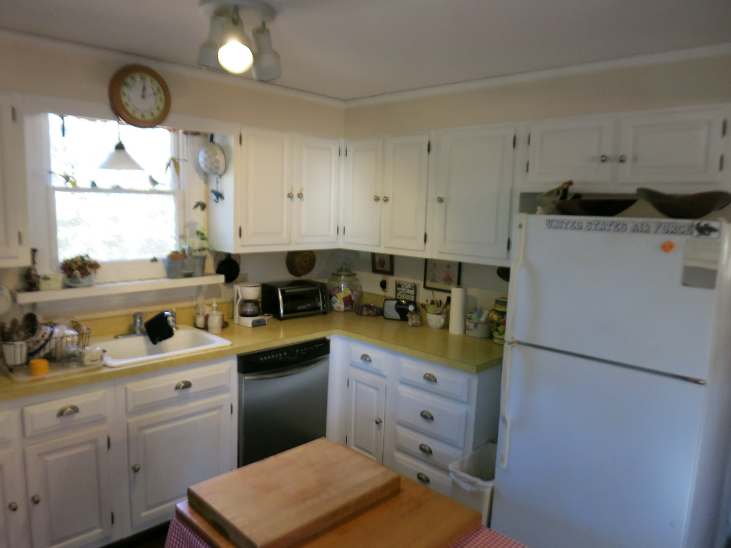 86 Marthas Road Edgartown, MA 02539 - Photo 13 of 25 a kitchen with a refrigerator and a sink