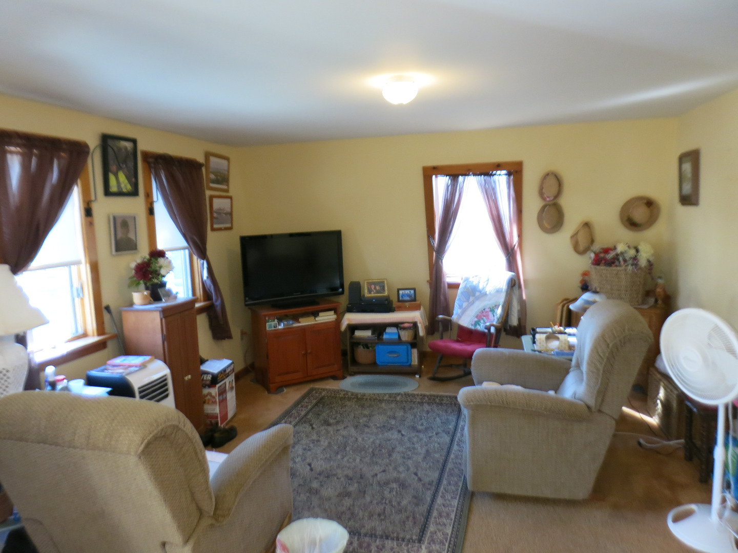 86 Marthas Road Edgartown, MA 02539 - Photo 21 of 25 a living room with furniture a flat screen tv and a large window