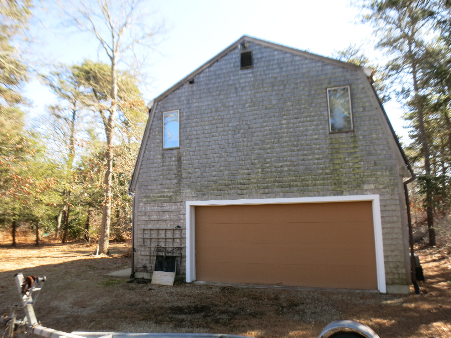 86 Marthas Road Edgartown, MA 02539 - Photo 3 of 25 a front view of a house with a yard