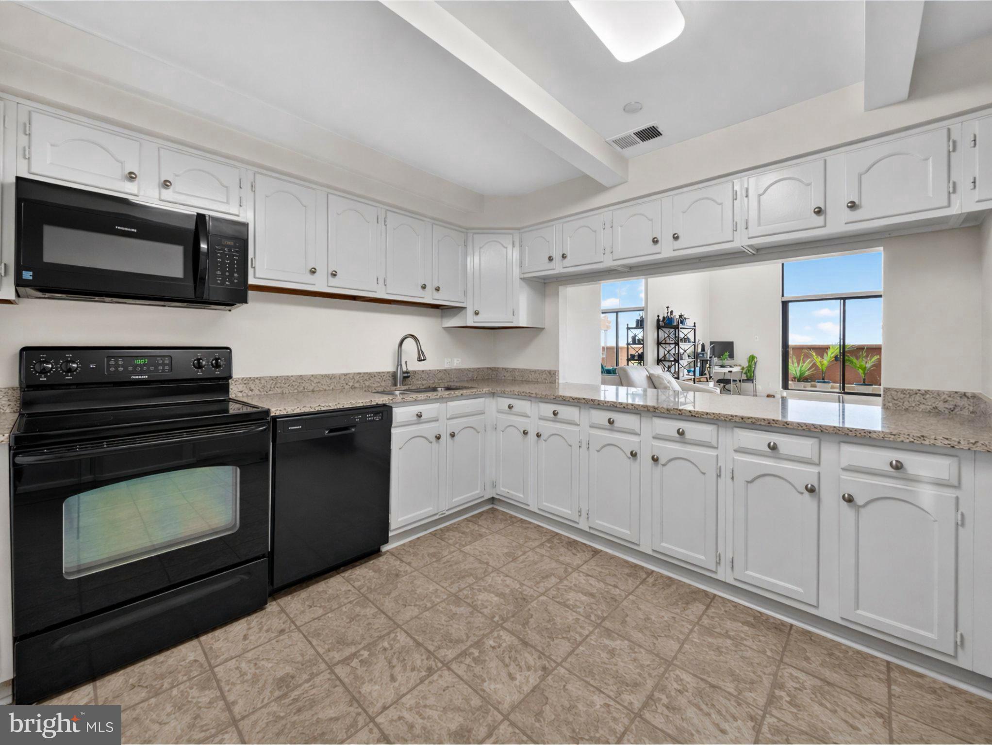 1301 North Courthouse Road, Unit 1803 Arlington, VA 22201 - Photo 7 of 35 Airy eat-in kitchen open to living room.