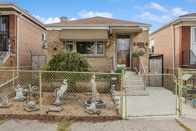 a view of a white house with large windows