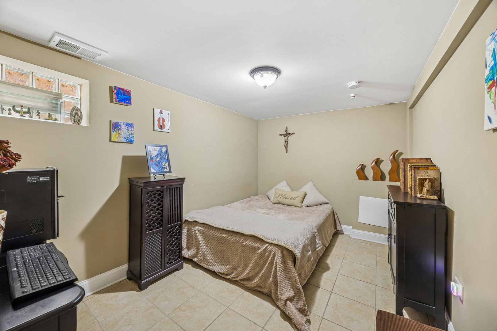 7535 West 63rd Place Summit, IL 60501 - Photo 15 of 19 a bedroom with a bed and cabinets