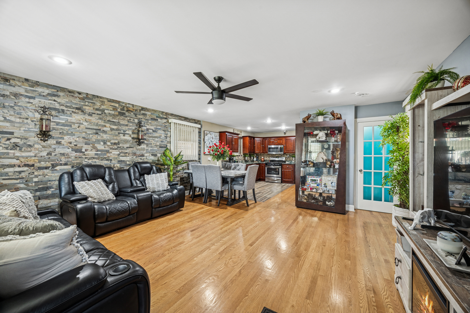7535 West 63rd Place Summit, IL 60501 - Photo 2 of 19 a living room with furniture and a large window with kitchen view