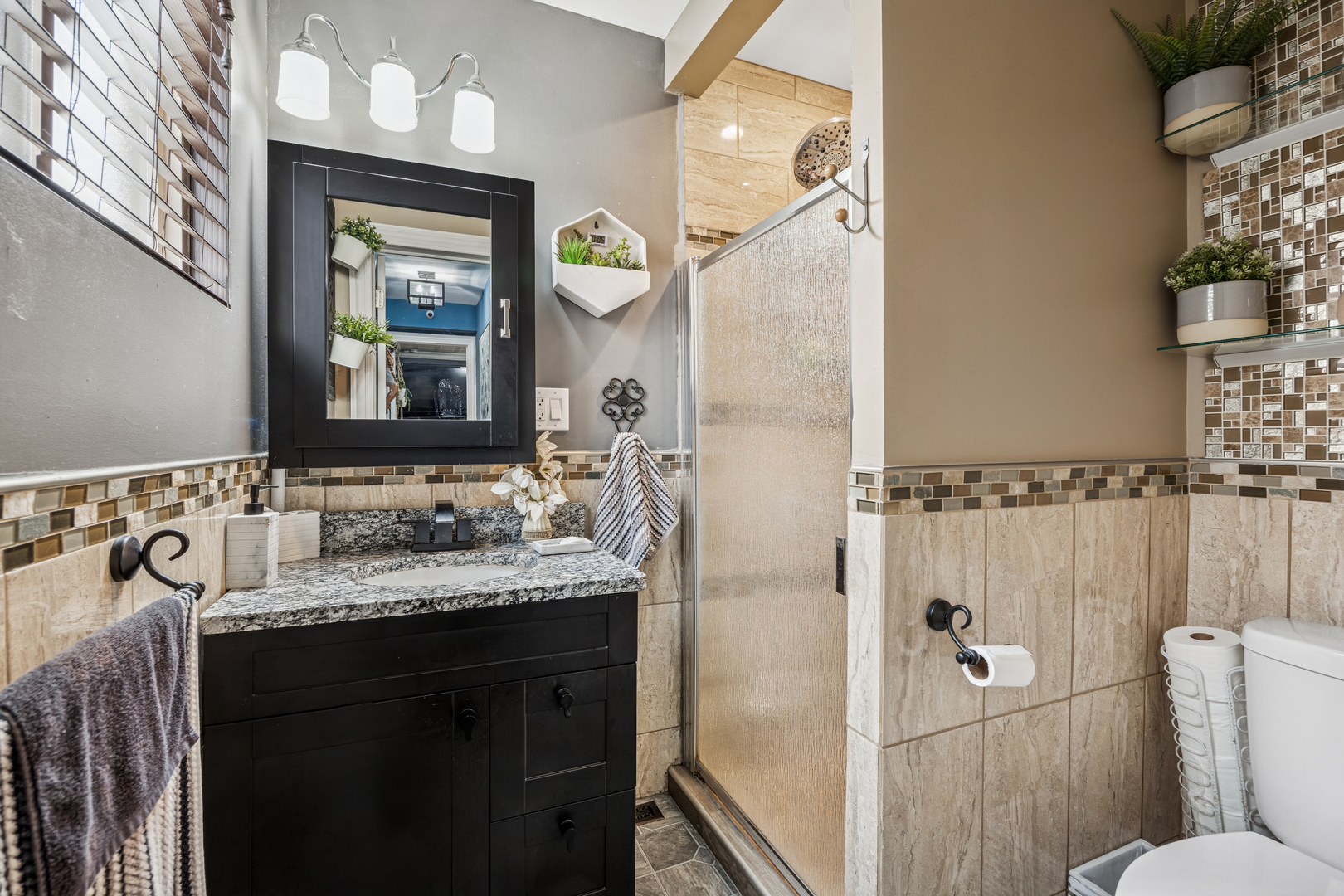 7535 West 63rd Place Summit, IL 60501 - Photo 8 of 19 a bathroom with a granite countertop sink mirror and a toilet