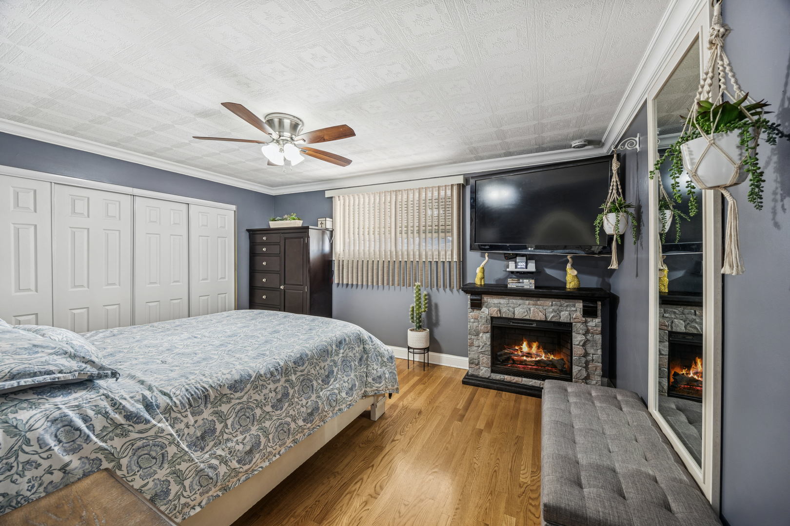 7535 West 63rd Place Summit, IL 60501 - Photo 9 of 19 a bedroom with a bed and a fireplace