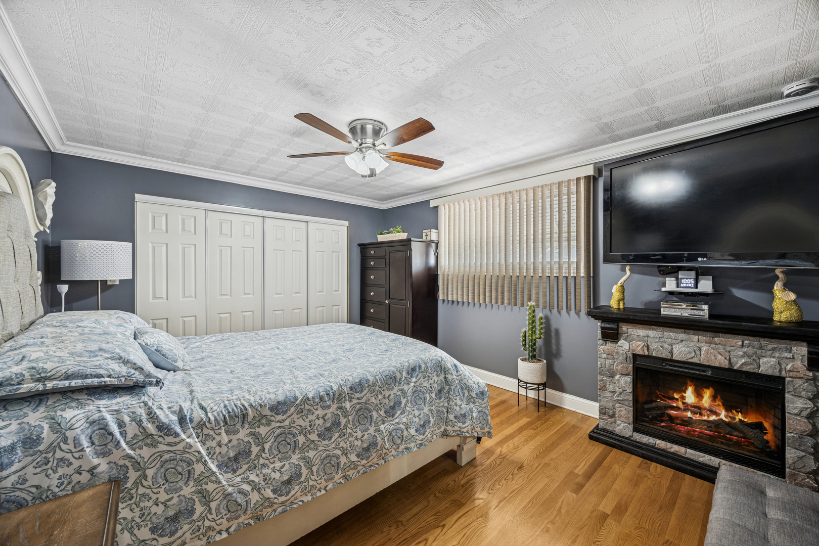 7535 West 63rd Place Summit, IL 60501 - Photo 10 of 19 a bedroom with a bed and a flat screen tv