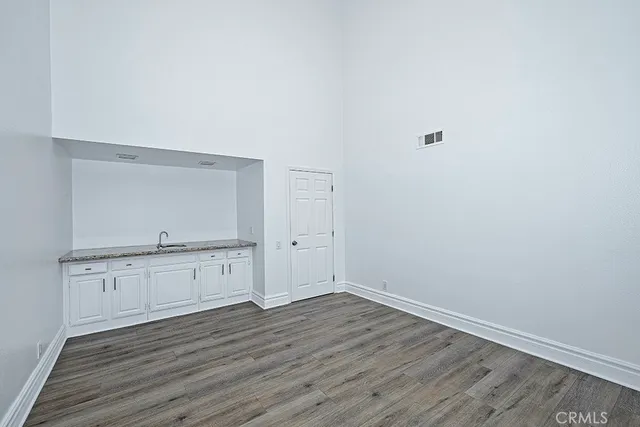 a view of a kitchen with wooden floor
