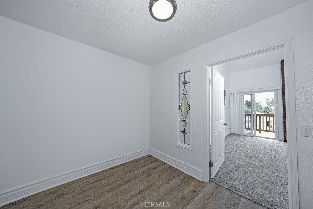28312 Driza Mission Viejo, CA 92692 - Photo 17 of 21 wooden floor in an empty room with a window