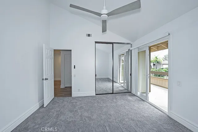 a view of an empty room with a glass door