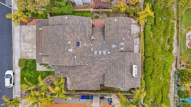aerial view of a house with a yard