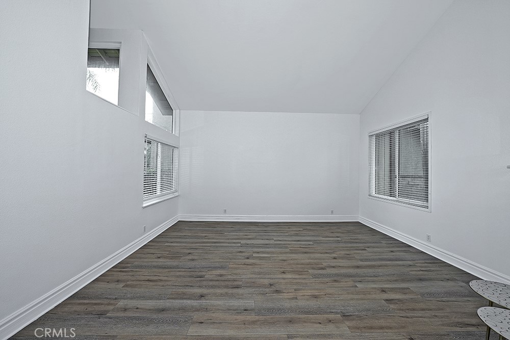 28312 Driza Mission Viejo, CA 92692 - Photo 7 of 21 a view of an empty room with wooden floor and a window