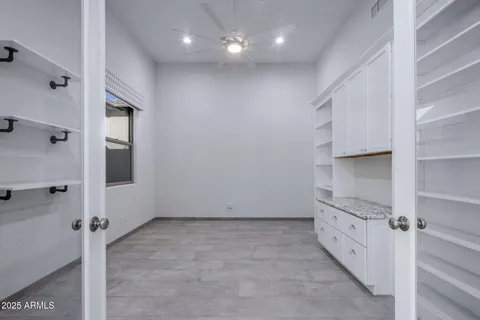a bathroom with a granite countertop sink a toilet and shower