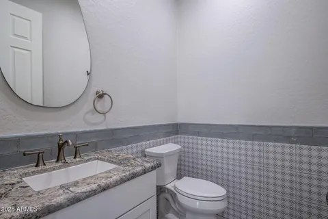 a view of a terrace with a floor to ceiling window