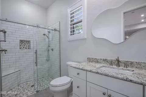 a view of a city with lush green forest