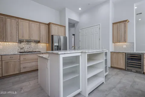 a kitchen with a sink stove and cabinets
