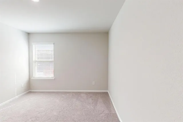a view of hallway with wooden floor