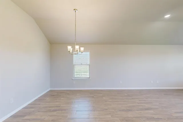 a view of kitchen with wooden floor and window
