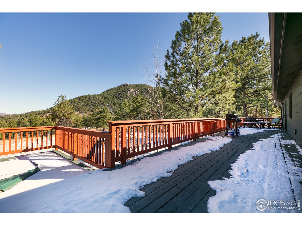 100 Cherokee Road Lyons, CO 80540 - Photo 28 of 38 Expansive decks with beautiful views of surrounding forest and valley