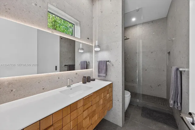 a bathroom with a double vanity sink and a mirror