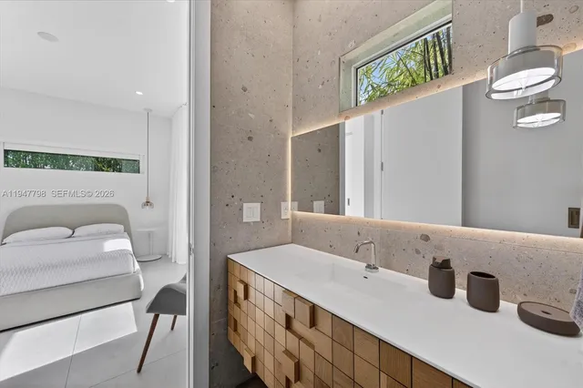 a bathroom with a sink and a mirror