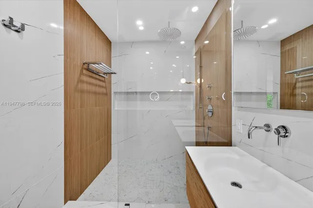 a bathroom with a bathtub and a sink