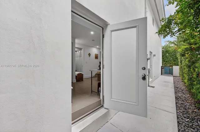 a bedroom with furniture and flat screen tv