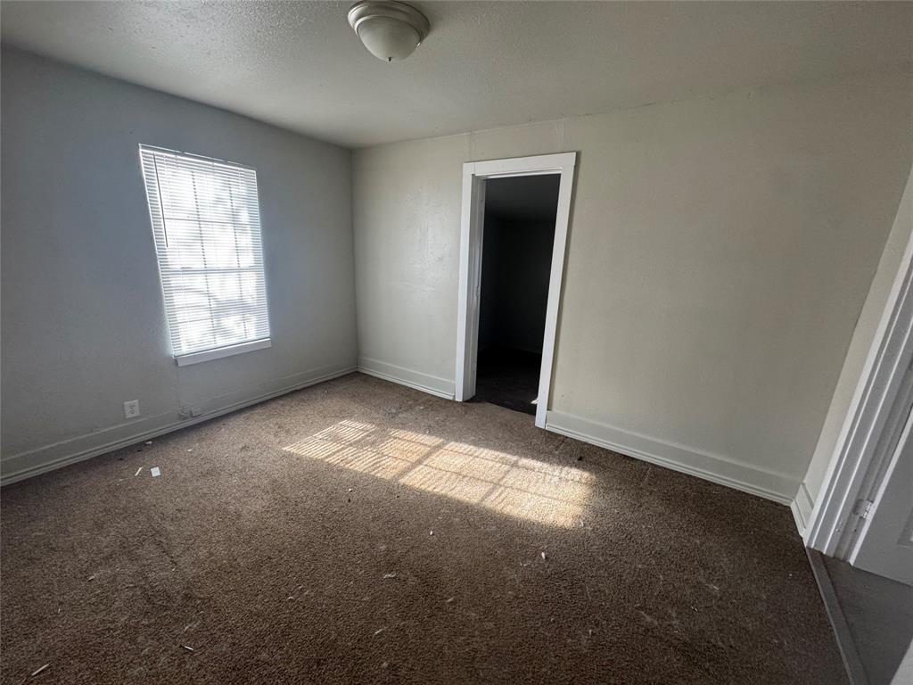 2410 Clinton Street Abilene, TX 79603 - Photo 3 of 7 an empty room with windows