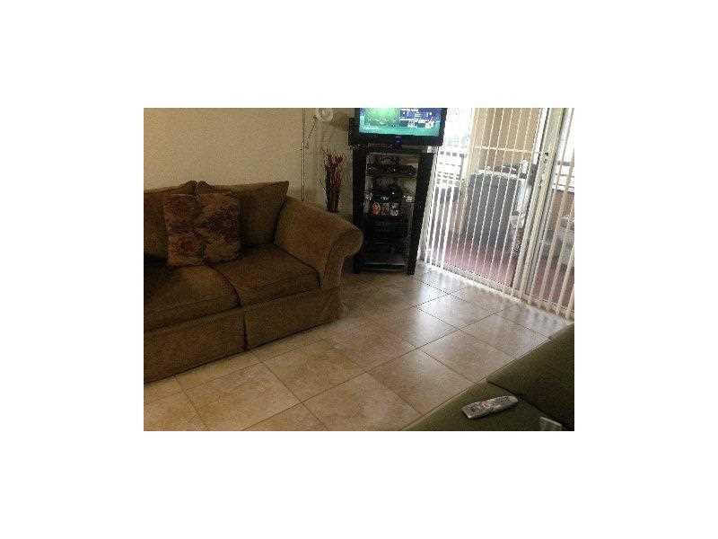 621 Lyons Road, Unit 9103 Coconut Creek, FL 33063 - Photo 6 of 9 Living Room