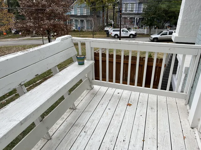 a balcony with sitting area