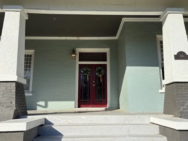 a view of front door and bedroom