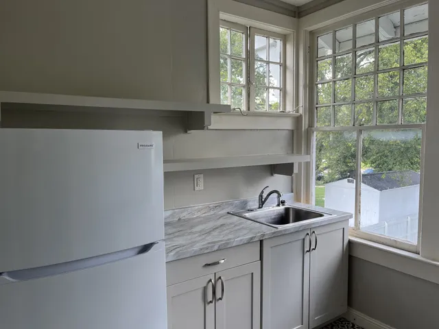 a kitchen with a sink and a window