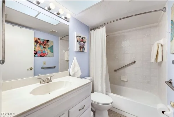 a view of a livingroom with furniture and a window