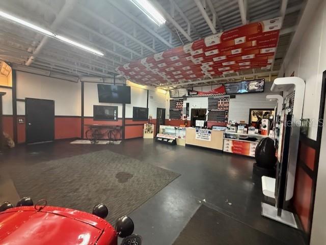 644 Maguire Road Ocoee, FL 34761 - Photo 25 of 37 a view of a room with gym equipment