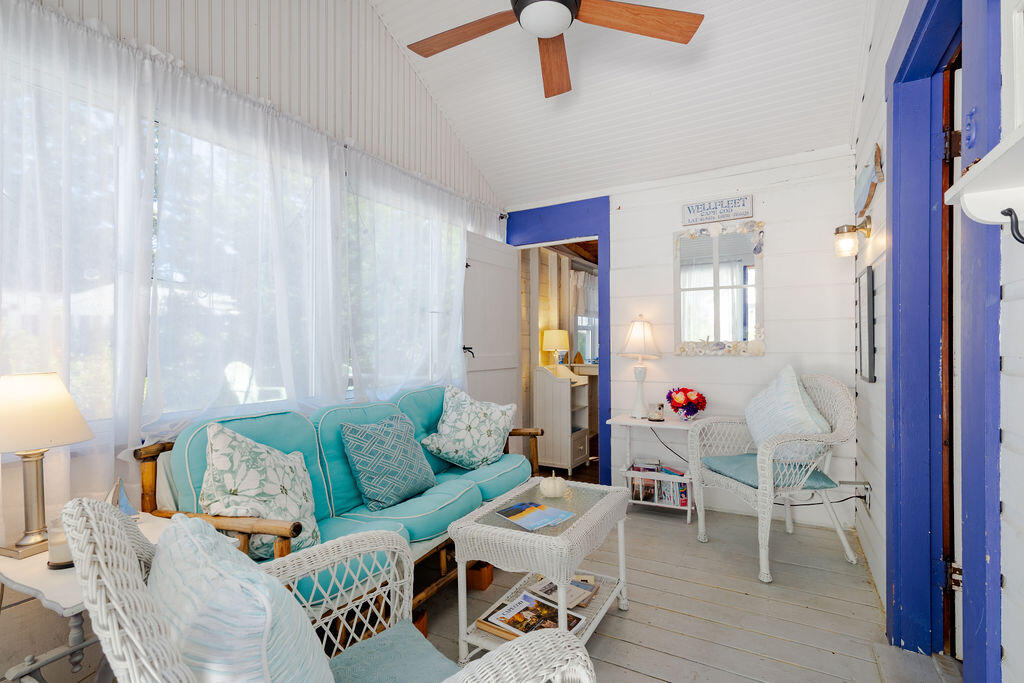 1937 State Highway Route 6, Unit E Eastham, MA 02642 - Photo 2 of 20 a living room with furniture and wooden floor