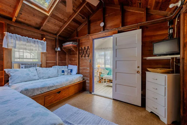 a bedroom with furniture and a window