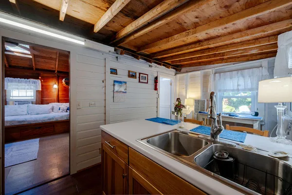 a kitchen that has a sink and a stove