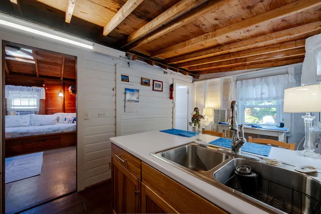 a kitchen that has a sink and a stove