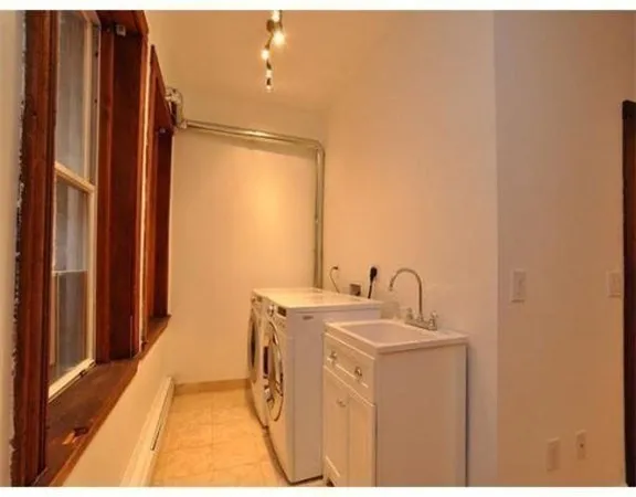 a utility room with dryer and washer