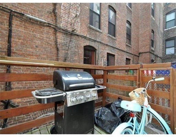 33 Charter Street, Unit 1 Boston, MA 02113 - Photo 13 of 15 a view of a chairs and table in a patio