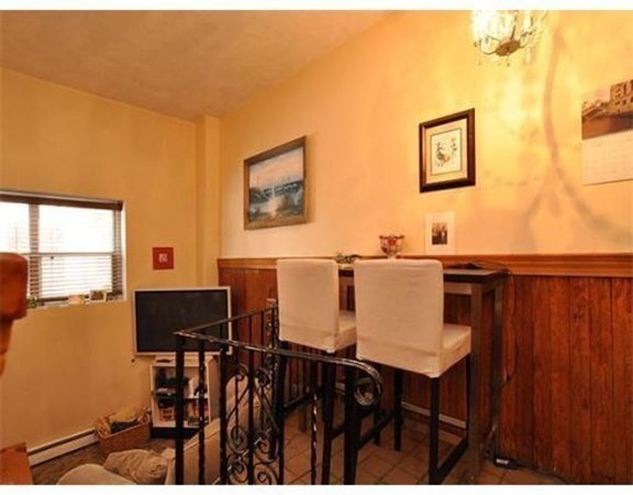 33 Charter Street, Unit 1 Boston, MA 02113 - Photo 2 of 15 a view of a dining room with furniture and chandelier