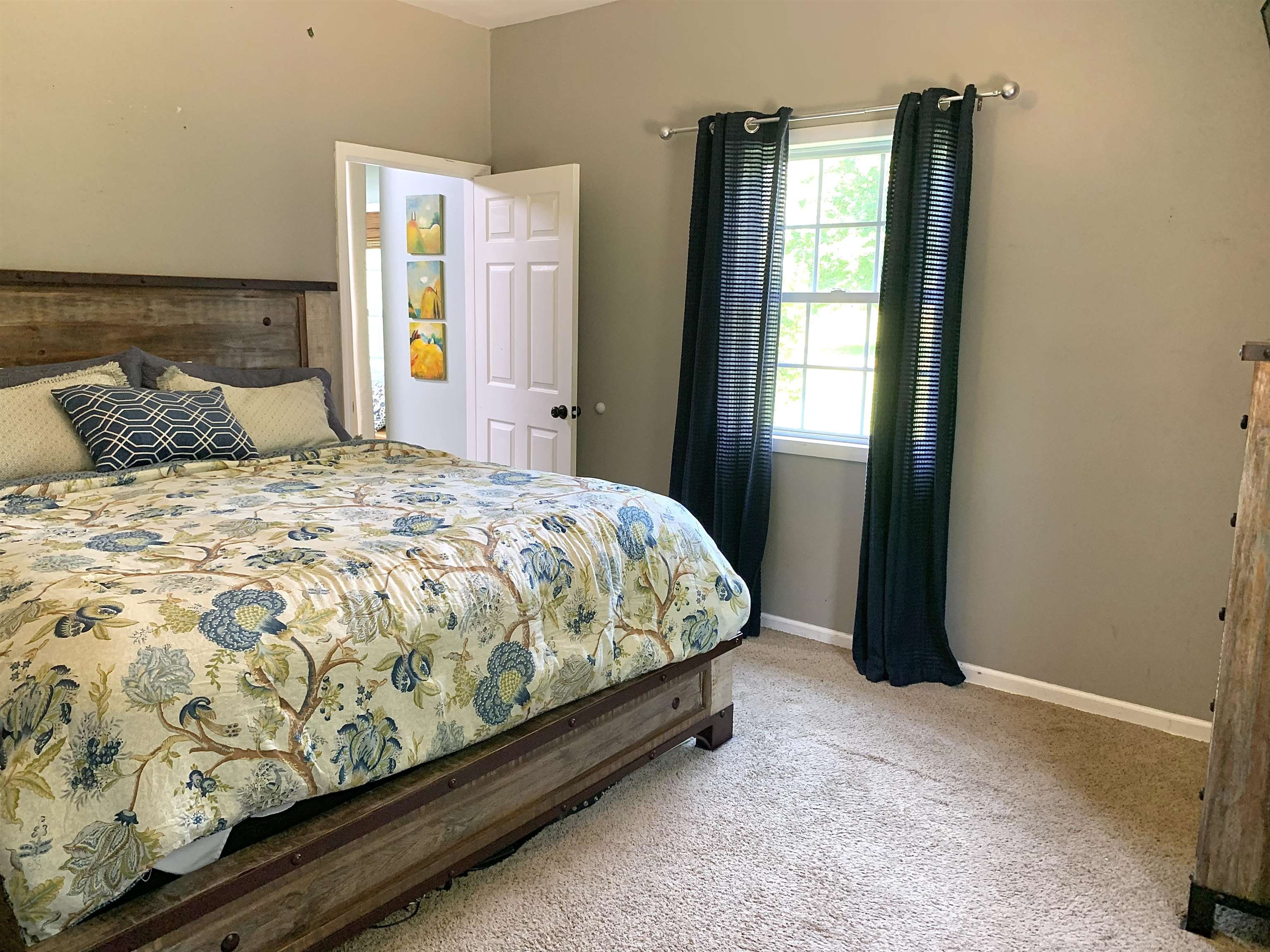 7675 Peavine Road Middleton, TN 38052 - Photo 12 of 26 a large bed sitting in a bedroom next to a window
