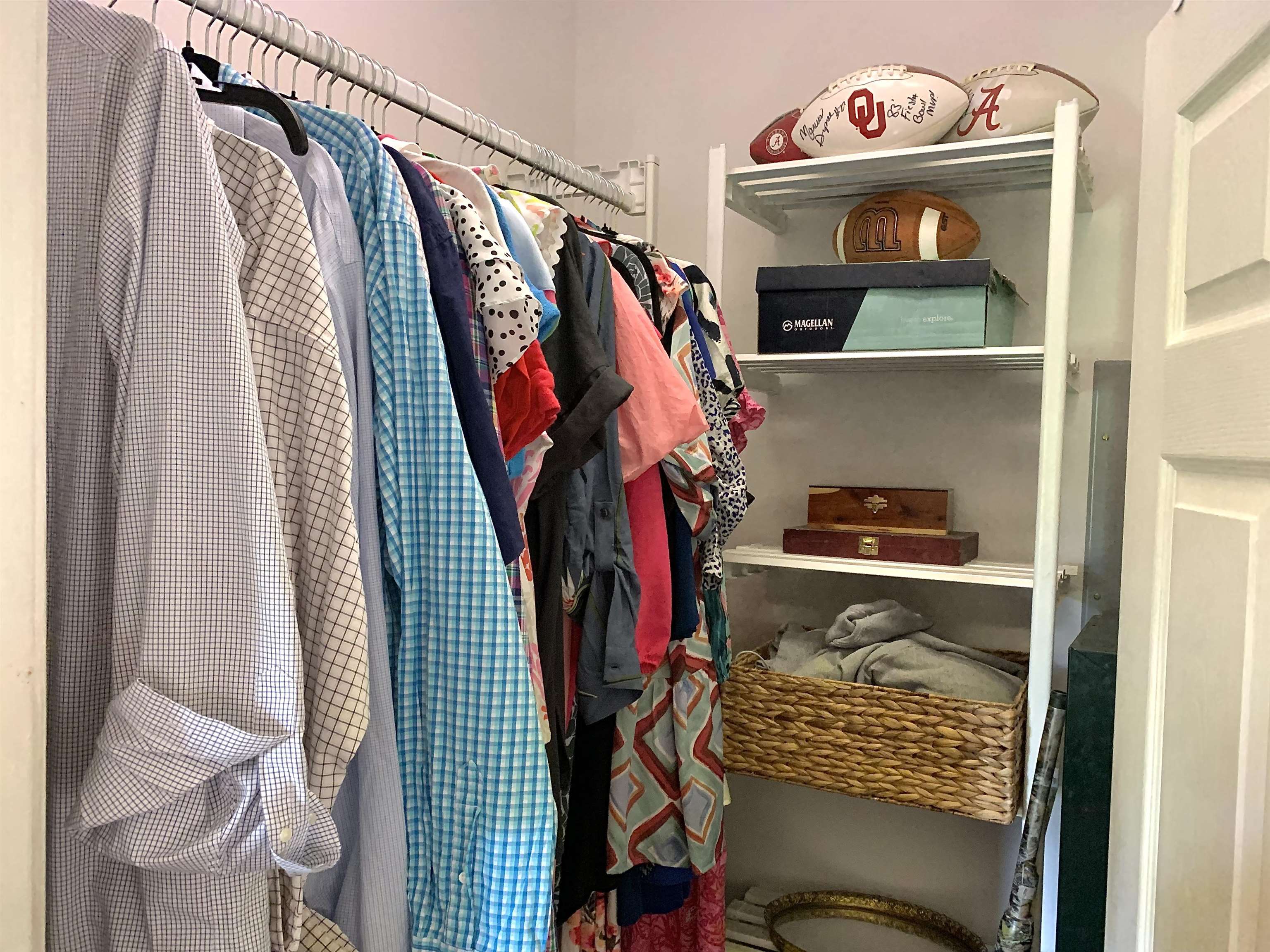 7675 Peavine Road Middleton, TN 38052 - Photo 15 of 26 a view of walk in closet with clothes and shoes